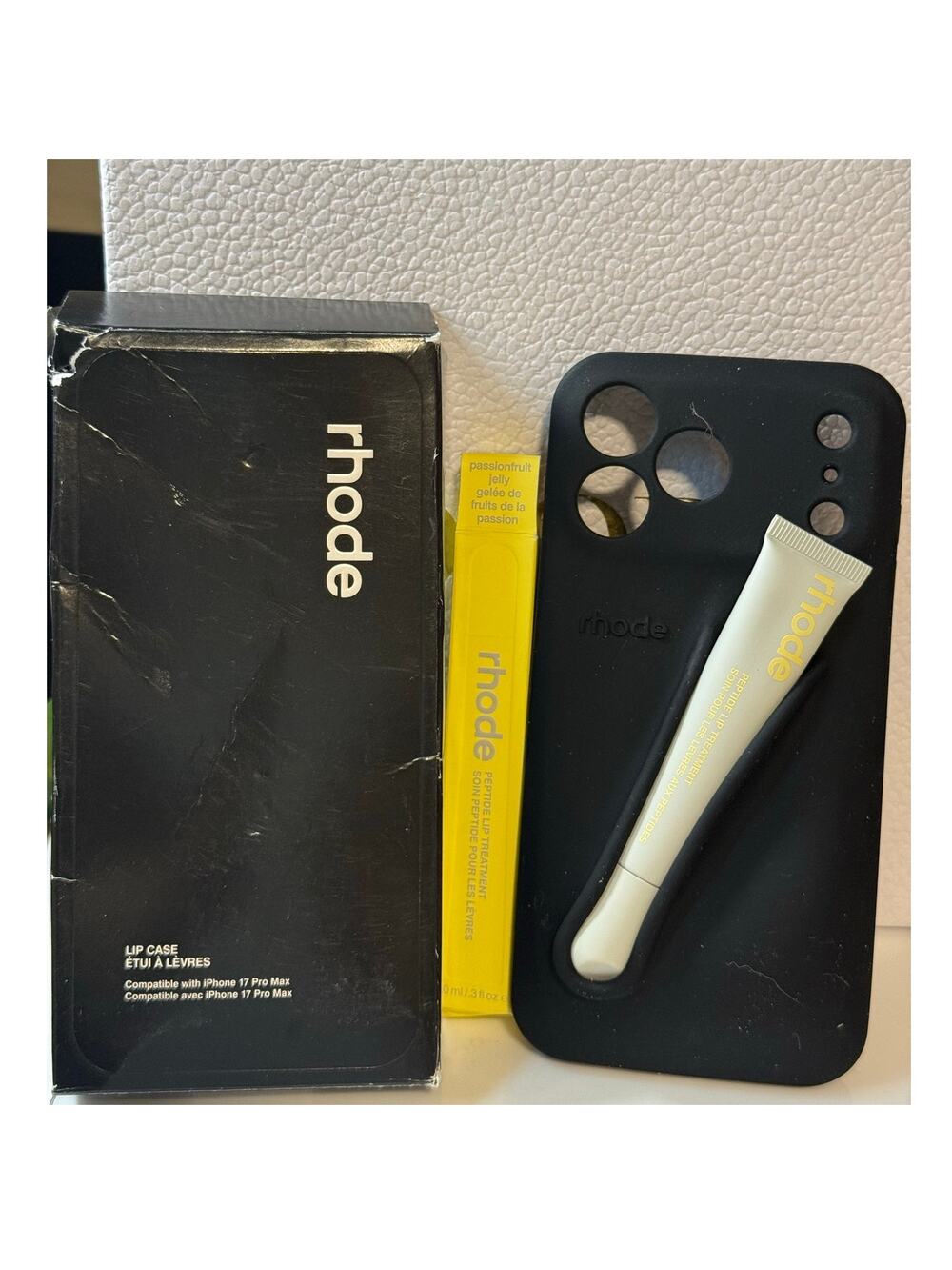 Black Rhode phone case paired w Rhode Peptide Lip Tint in Passionfruit Jelly-NEW